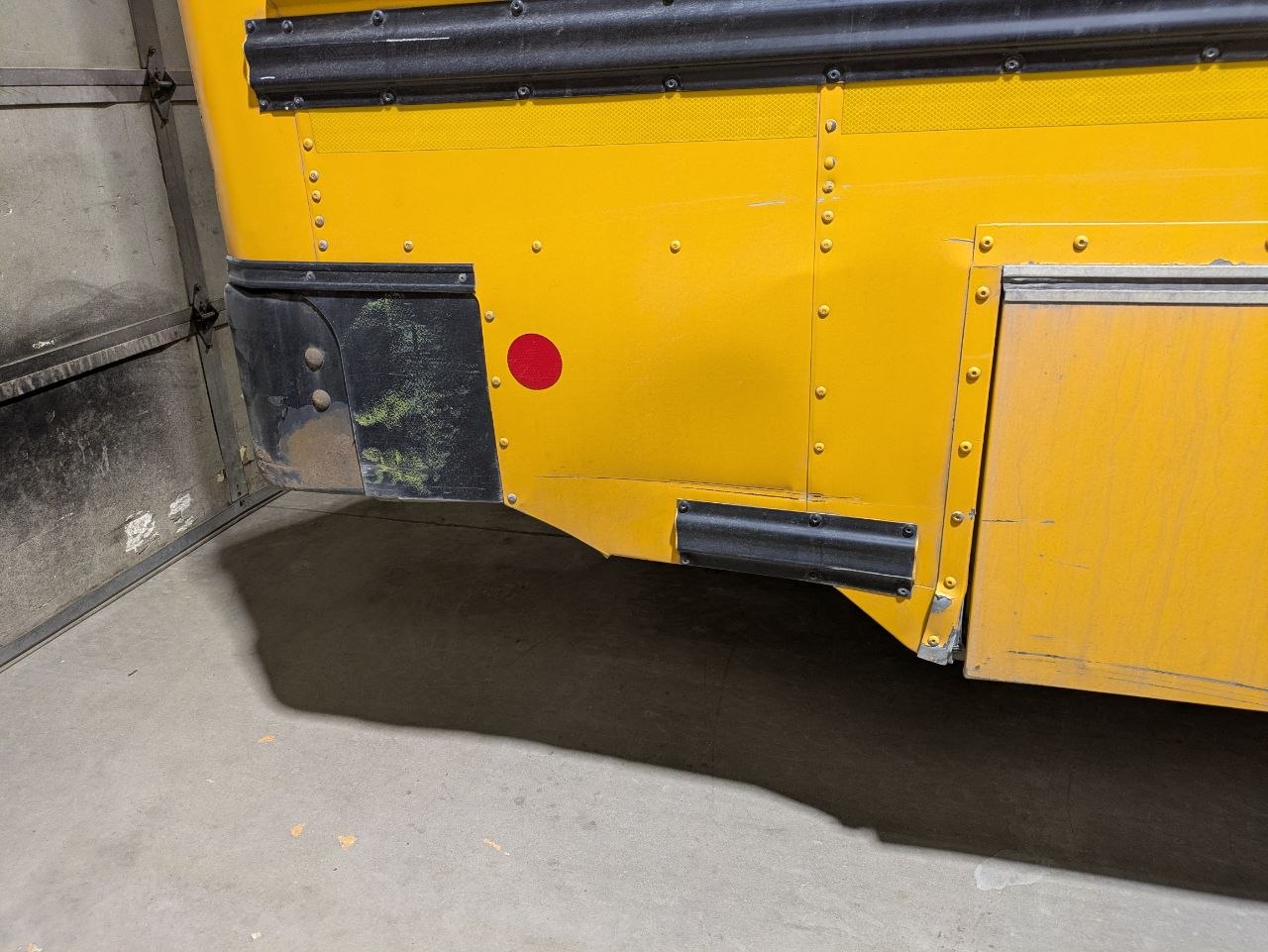 Before — side skirt panel damage